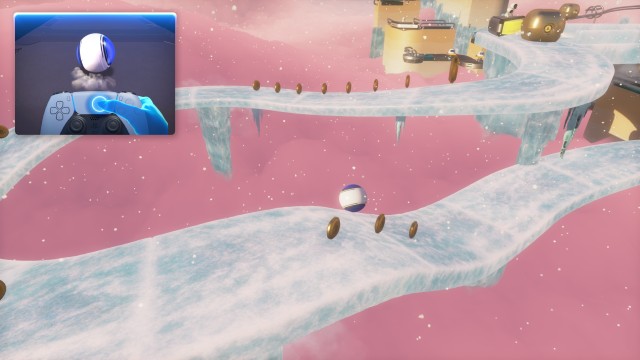 Screenshot: Astro in einem Ball per Bewegungssteuerung im Eis-Level lenken: Das Spiel soll primär die Fähigkeiten des Dualsense Controllers demonstrieren, wie hier der Einsatz des Touchpads zur Steuerung