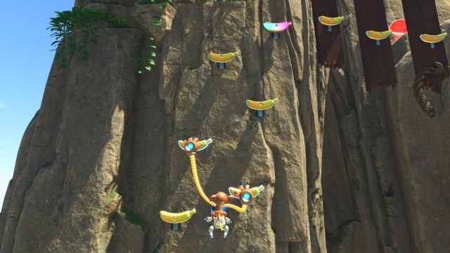 Screenshot: Mit den Affenhänden kann Astro Bot an bananenförmigen Haltegriffen hochklettern oder Steine werfen